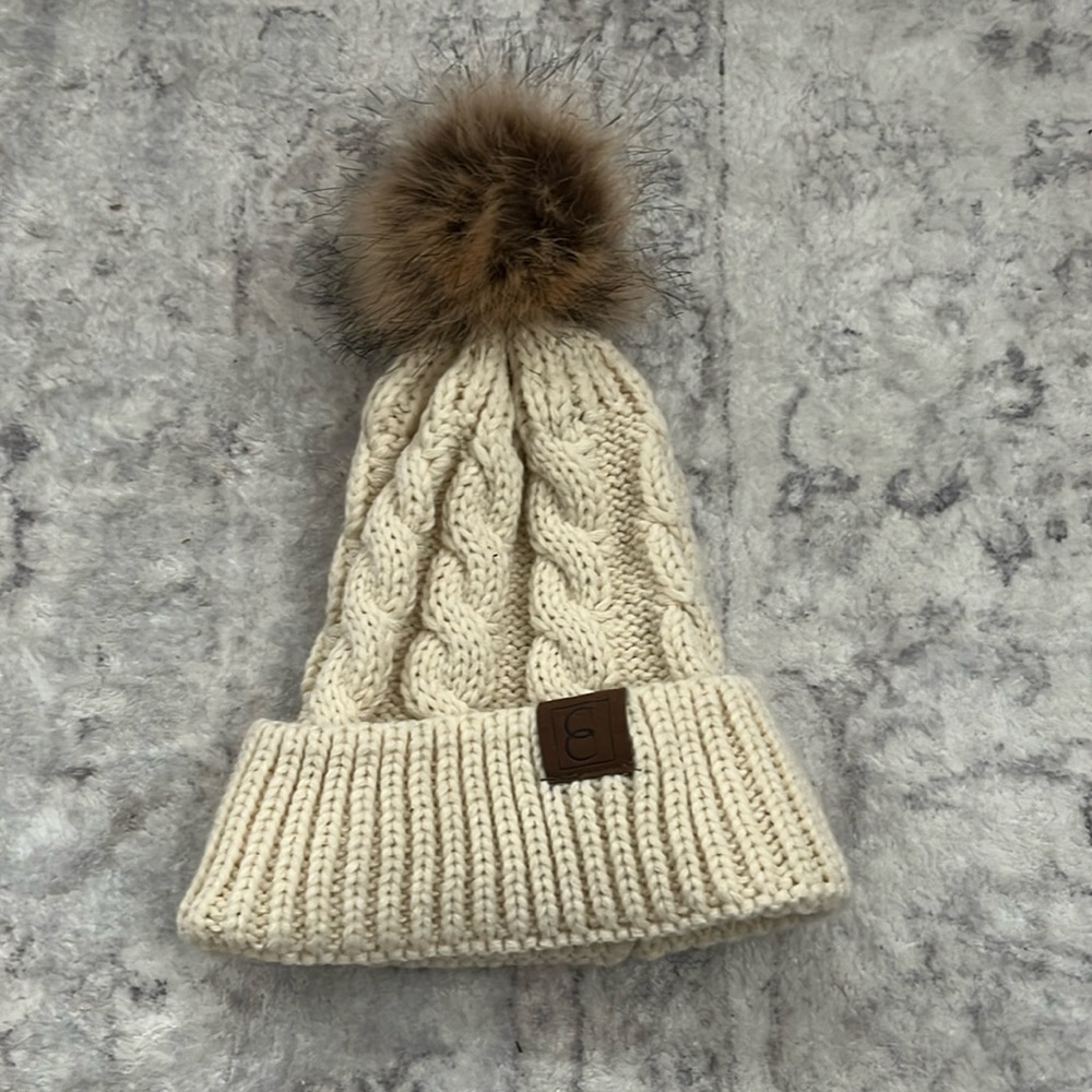 Cream and brown hat